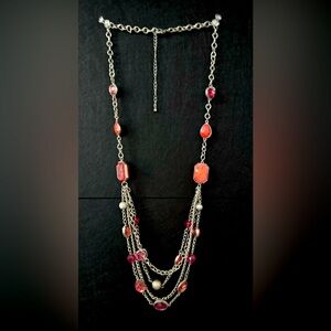 Long silver layered necklace with pinks and peaches